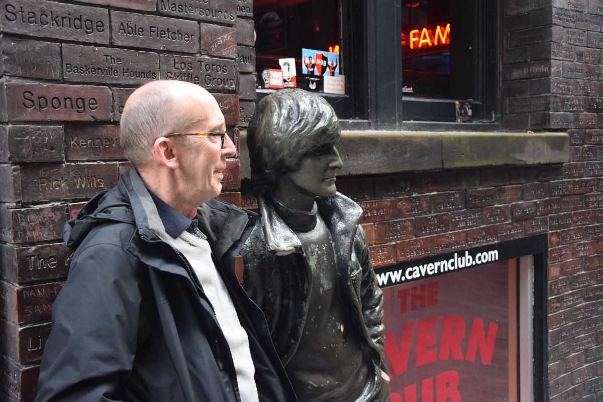Photo of author at statue of John Lennon outside of the Cavern pub in Liverpool